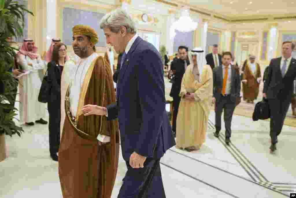 U.S. Secretary of State John Kerry walks with Yusuf bin Alawi bin Abdullah, Oman&#39;s Minister of Foreign Affairs, during a meeting of Gulf foreign ministers at Riyadh Air Base, Saudi Arabia, March 5, 2015.
