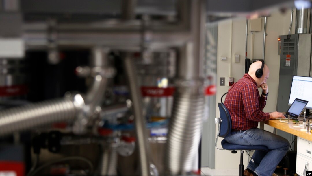 FILE - A man works in the quantum computing lab at the IBM Thomas J. Watson Research Center in Yorktown Heights, N.Y. , Feb. 27, 2018.