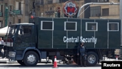 An Egyptian riot police officer is seen outside El Sadat metro station at Tahrir square in the center of Cairo, Egypt May 13, 2018. 