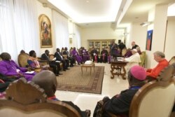 FILE - Pope Francis attends a meeting at the end of a two day Spiritual retreat with South Sudan leaders at the Vatican, April 11, 2019.
