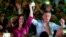 FILE - Mauricio Macri, presidential candidate of the Cambiemos alliance, and Maria Eugenia Vidal, Buenos Aires province governor-elect, appear at a rally in Lanus on the outskirts of Buenos Aires, Oct. 21, 2015.