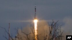 FILE - The Soyuz rocket booster with Soyuz MS-2 space ship carrying a new crew to the International Space Station blasts off in Russian leased Baikonur cosmodrome, Kazakhstan.