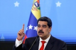 FILE - Venezuelan President Nicolas Maduro speaks during a news conference in Caracas, Dec. 8, 2020.