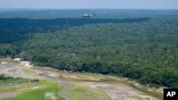 Marine One carrying President Joe Biden flies over the Amazon during a tour, Nov. 17, 2024, in Manaus, Brazil.