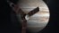 This NASA image shows an artist rendering of the Juno spacecraft circling Jupiter.