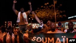 Supporters of opposition leader Soumaila Cisse, who was kidnapped in March 2020, cheer ahead of his arrival at Modibo Keita International Airport in Bamako, Mali, on Oct. 8, 2020.