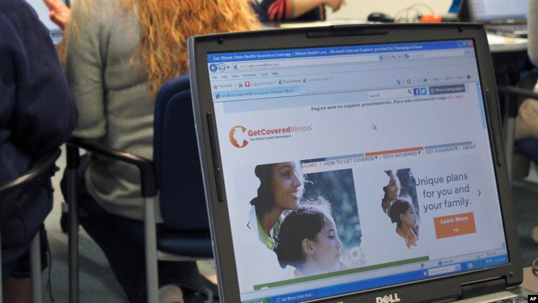 Public health office staff members in Illinois work with people trying to sign up for health care coverage through the Affordable Care Act, also known as Obamacare, October 1, 2013.