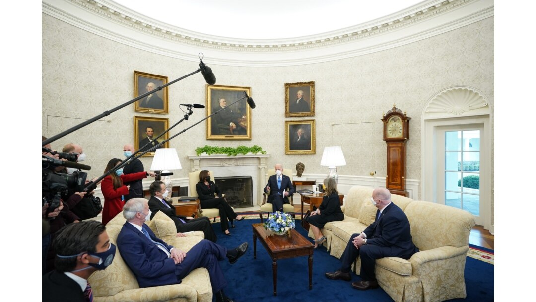 FILE - U.S. President Joe Biden and Vice President Kamala Harris meet with governors and mayors on his COVID-19 relief plan, in the Oval Office of the White House, Feb. 12, 2021.