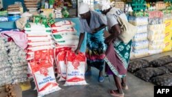 FILE: Two elderly women shop for mealie meal and other basic commodities, March 14 2019.