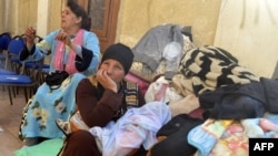 Egyptian Coptic Christians sit in the courtyard of the Evangelical Church in the Suez Canal city of Ismailiya, Feb. 24, 2017, upon arriving to take refuge from Islamic State (IS) group jihadists.