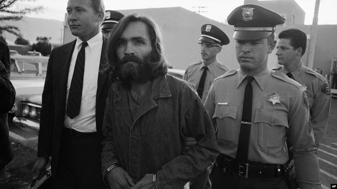 Charles M. Manson, leader of a hippie cult accused of multiple murders, leaves a Los Angeles courtroom, Dec. 22, 1969 after telling a judge "lies have been told" about him.