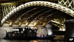 A boat taking part in the rescue operations is anchored under Margaret Bridge in Budapest, Hungary, June 5, 2019. 