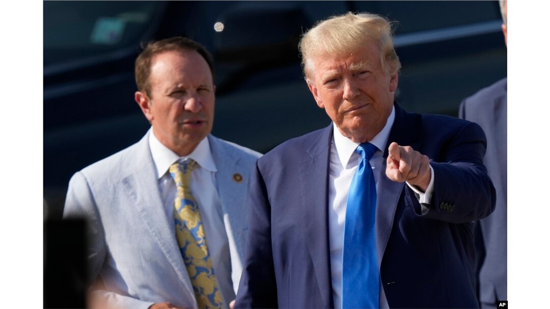 FILE - Former President Donald Trump arrives at New Orleans International Airport on July 25, 2023, accompanied by then-Louisiana Attorney General Jeff Landry. Nearly 60% of Louisiana voters chose Trump in the 2020 presidential election.