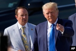 FILE - Former President Donald Trump arrives at New Orleans International Airport on July 25, 2023, accompanied by then-Louisiana Attorney General Jeff Landry. Nearly 60% of Louisiana voters chose Trump in the 2020 presidential election.