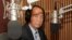 Mam Sonando, the owner of Beehive Radio, is the guest on 'Hello VOA' in live Voice of America studio in Washington, D.C on Monday May 27, 2013. The operator of one of only seven stations that carry VOA Khmer content said the ban proved both the popularity and necessity of foreign programming.