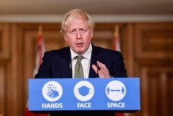 Britain's Prime Minister Boris Johnson speaks during a coronavirus briefing in Downing Street, London, Oct. 12, 2020.