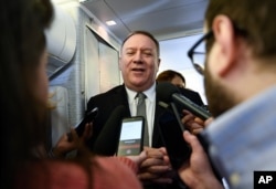 Secretary of State Mike Pompeo takes questions from reporters during a flight from Andrews Air Force Base, Maryland, to Germany, Feb. 13, 2020.