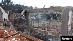 A firefighters works on the scene after a blast at an ammunition factory in Balikesir province, Turkey, Dec. 24, 2024. (Ihlas News Agency via Reuters)