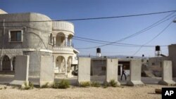 A resident walks in the village of Ghajar on the border with Lebanon, northern Israel, 17 Nov 2010