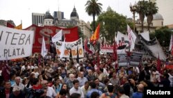 Demonstrators gather during a protest against economic policies implemented by Argentina's President Mauricio Macri in Buenos Aires, Argentina, Dec. 22, 2015. 