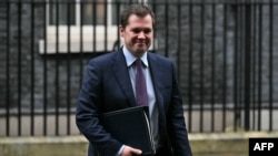 British Immigration Minister Robert Jenrick leaves 10 Downing Street in central London on Dec. 5, 2023, after attending a cabinet meeting. Jenrick resigned his post over a bill that would allow Britain to deport migrants to Rwanda.