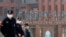 FILE - Security personnel keep watch outside the Wuhan Institute of Virology during the visit by the World Health Organization (WHO) team tasked with investigating the origins of the coronavirus disease, in Wuhan, Hubei province, China, Feb. 3, 2021.