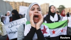 Women take part in a demonstration against Syria's President Bashar al-Assad, May 31, 2012.