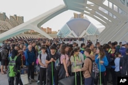 Thousands of volunteers show up at the City of Arts and Sciences cultural complex on Nov. 2, 2024, to be assigned work schedules to help with the clean up operation after floods in Valencia, Spain.