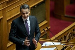 Greece's Prime Minister Kyriakos Mitsotakis, delivers a speech during a parliament session in Athens, Dec. 18, 2019.