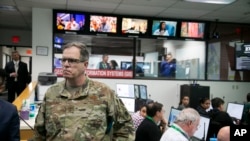 Major General Michael T. McGuire, the Director of the State of Arizona Department of Emergency and Military Affairs (DEMA) is looking as members of DEMA work responding to the coronavirus pandemic, Phoenix, March 18, 2020.