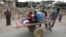A displaced Iraqi family is transported on a cart as the battle between the Iraqi Counter Terrorism Service and Islamic State militants continues nearby, in western Mosul, April 23, 2017.