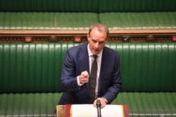 British Foreign Secretary Dominic Raab, deputizing for Prime Minister Boris Johnson, speaks during Prime Minister's Questions in the House of Commons Chamber in London, Britain, April 29, 2020.