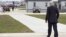 Secretary of State John Kerry walks from his plane after arriving in Chicago, April 15, 2013, to visit the parents Anne Smedinghoff, the young U.S. diplomat killed in Afghanistan while delivering textbooks.