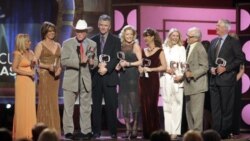 Cast members of "Dallas" accept the pop culture award at the TV Land awards show in 2006 in Santa Monica, California. The awards honor classic shows and performers. From left: Charlene Tilton, Linda Gray, Larry Hagman, Patrick Duffy, Sheree Wilson, Mary C
