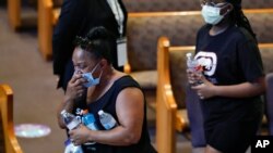 George Floyd laid to rest as calls for reform continue