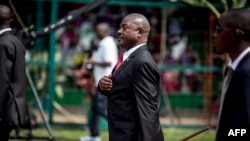 (FILES) In this file photo taken on July 01, 2015 Burundi's President Pierre Nkurunziza gestures as he arrives for celebrations of the country's 53rd Independence Anniversary at Prince Rwagasore Stadium in Bujumbura. - The Burundian president,…