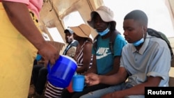 FILE - Cholera patients are rehydrated with salt and sugar solution at Kuwadzana Polyclinic in Harare, Zimbabwe, Nov. 24, 2023.