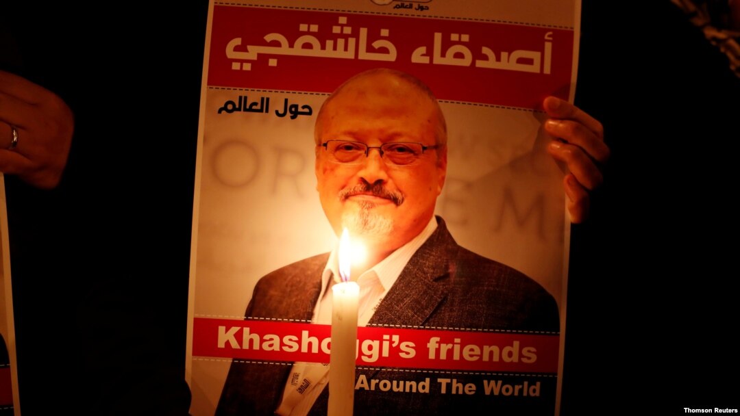 FILE PHOTO: A demonstrator holds a poster with a picture of Saudi journalist Jamal Khashoggi outside the Saudi Arabia consulate in Istanbul