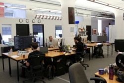 FILE - Reddit employees work at the company's headquarters in San Francisco, California, April 15, 2014.