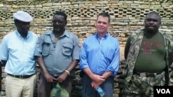 FILE - Ambassador Bruce Wharton at Naletale National Monument with Gweru mayor Hamutendi Kombayi (left) and Norbert Nhutsve (right), regional director of National Museums and Monuments of Zimbabwe. (Photo/Taurai Shava)