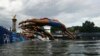 Athletes compete in the swimming race in the Seine during the women's individual triathlon at the 2024 Summer Olympics, July 31, 2024 in Paris, France.