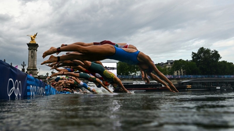 Women triathletes swim in Seine River after days of concerns about water quality
