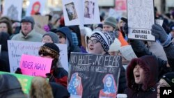 People protest at a demonstration in Market Square, Feb. 3, 2017, in Cleveland. The demonstration was organized in protest of President Donald Trump's immigration order.