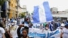 Nicaragüenses exiliados en Costa Rica participan en una marcha denominada "Nicaragua no estás sola", contra el Gobierno del presidente nicaragüense Daniel Ortega y las próximas elecciones generales del 7 de noviembre, el 18 de julio 2021.