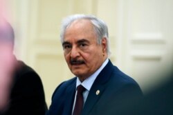 FILE - Libyan Gen. Khalifa Hifter joins a meeting with the Greek Foreign Minister Nikos Dendias and other officials in Athens, Jan. 17, 2020.