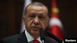 Turkish President Tayyip Erdogan during a meeting at the Turkish parliament in Ankara, Turkey, July 7, 2018.