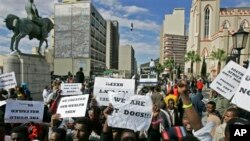 Foreigners demonstrate outside the South African Parliament.