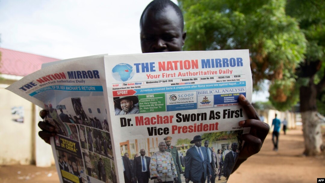 FILE - A South Sudan resident reads a copy of the Nation Mirror, April 27, 2016. 