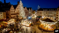 Lights illuminate the Christmas market in Frankfurt, Germany, Nov. 22, 2021.