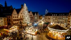 Lights illuminate the Christmas market in Frankfurt, Germany, Nov. 22, 2021.